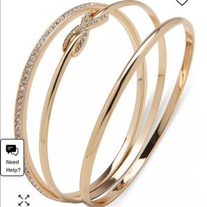 Anne Klein triple gold toned pave infinity bracelets.
